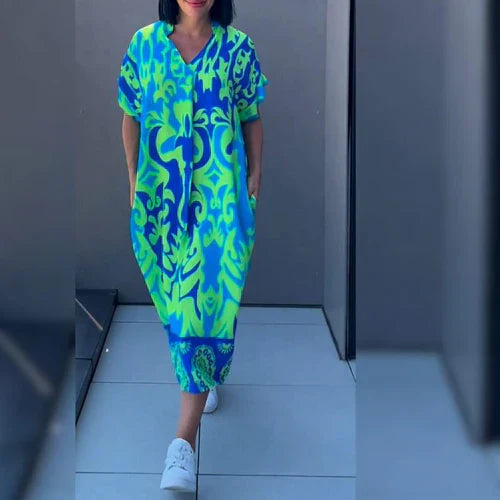 Elena™ - Elegancka sukienka w kwiaty zapewniająca romantyczny i wyrafinowany wygląd
